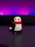 3D Printed Wind-Up Penguin Toy with Red Scarf